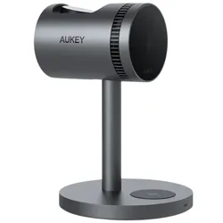 A sleek AUKEY wireless charging stand with a cylindrical design on a vertical support and circular base, featuring a wireless charging symbol on the base.