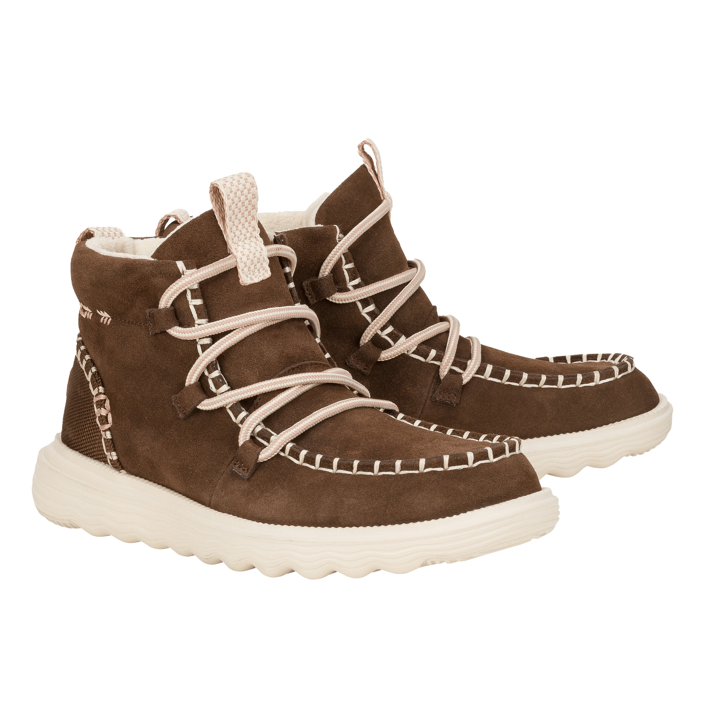 Hey Dude Reyes Suede Boots are brown ankle-high boots with a soft suede exterior, intricate white stitching, cushioned white soles, and a lace-up design for comfort and support.