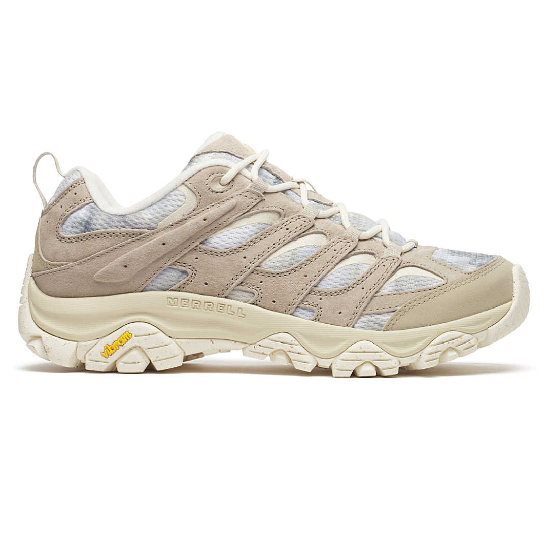 Merrell hiking shoe featuring a beige and white design with a sturdy Vibram sole.