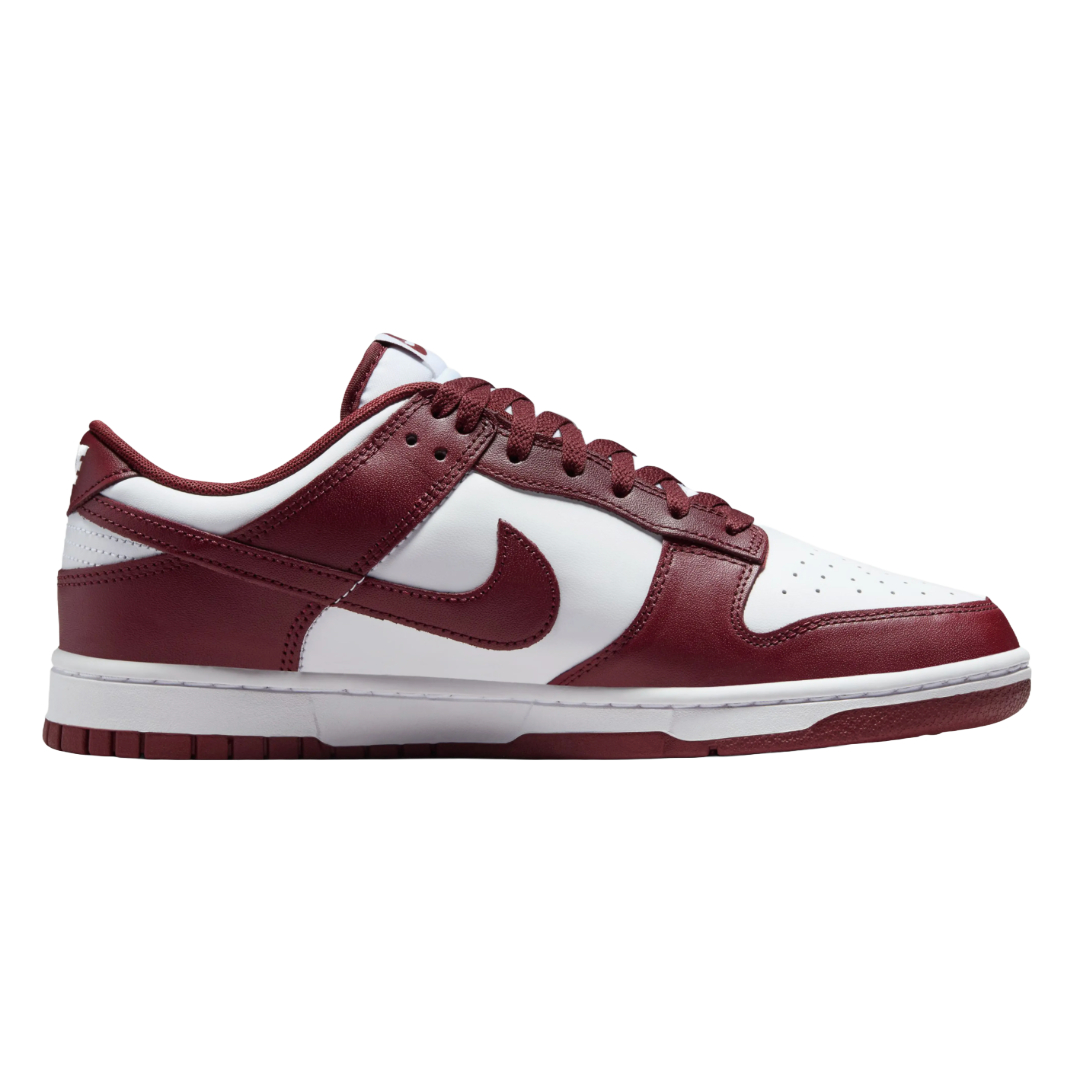 Nike Men's Dunk Low Retro Shoes feature a burgundy and white color scheme with a low-cut design, leather upper, and signature swoosh logo. The shoes have a classic athletic silhouette with a padded collar and durable rubber sole.