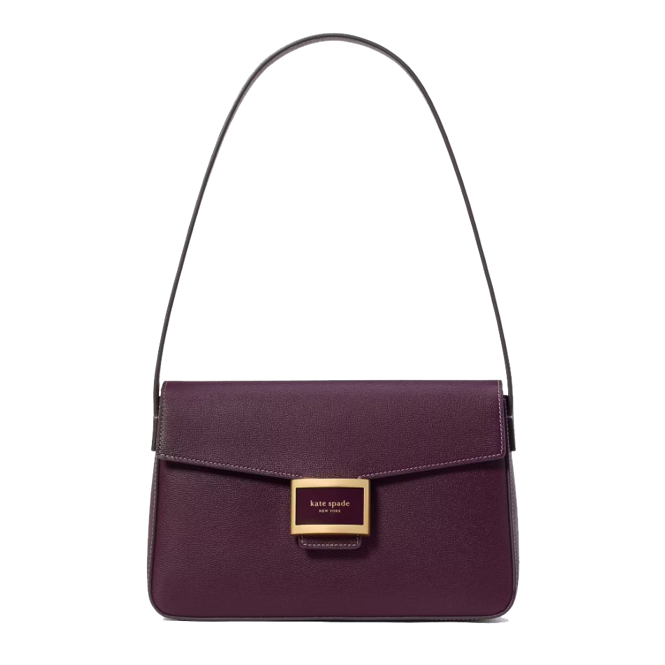 Purple shoulder bag with a structured design, featuring a front flap and a gold-tone Kate Spade New York logo plaque.