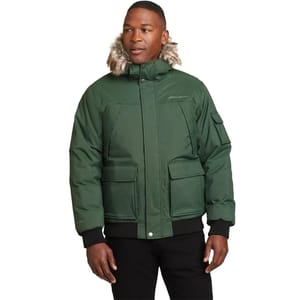 Green winter jacket with fur-trimmed hood, front pockets, and sleeve compartments.