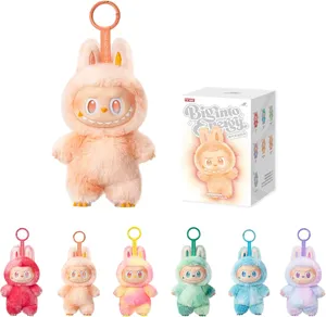 A collection of plush keychains from Pop Mart featuring characters called \“Bunny Energy\“ in various colors, including peach, pink, yellow, green, blue, and purple, with a display box showing branding and a main character image.