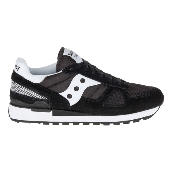 Black and white athletic sneaker with a mesh and suede design, featuring a distinctive \“S\“ logo on the side and a waffle-patterned sole for grip.