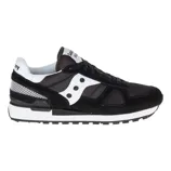Black and white athletic sneaker with a mesh and suede design, featuring a distinctive \“S\“ logo on the side and a waffle-patterned sole for grip.