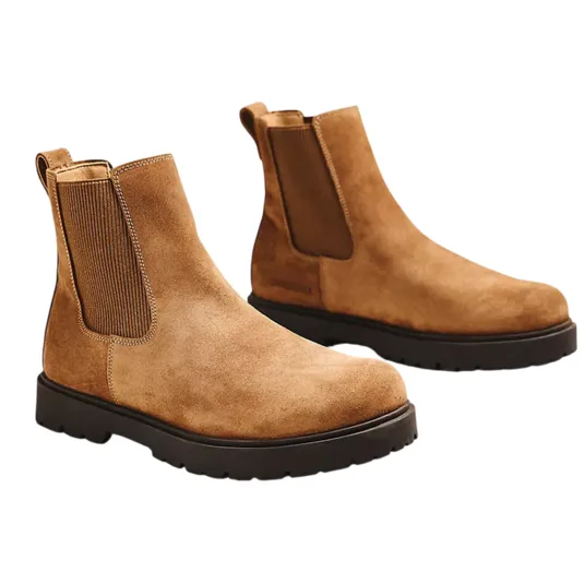 Tan suede Chelsea boots with elastic side panels, pull tabs, and black rubber soles.