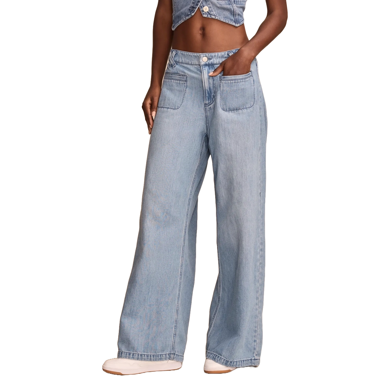 Wide-leg, light-wash denim jeans with large front patch pockets, paired with a matching denim crop top.