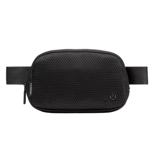 A black Lululemon belt bag with a mesh design, featuring a zippered closure and an adjustable strap.