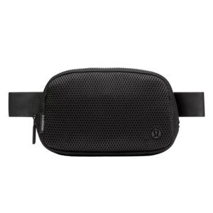 A black Lululemon belt bag with a mesh design, featuring a zippered closure and an adjustable strap.