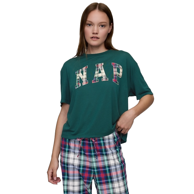Green short-sleeve graphic tee with \“NAP\“ in plaid-patterned letters on the front, paired with multicolored plaid pajama pants.