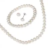 A set of white pearl jewelry including a necklace and matching stud earrings.