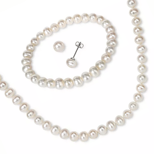 A set of white pearl jewelry including a necklace and matching stud earrings.
