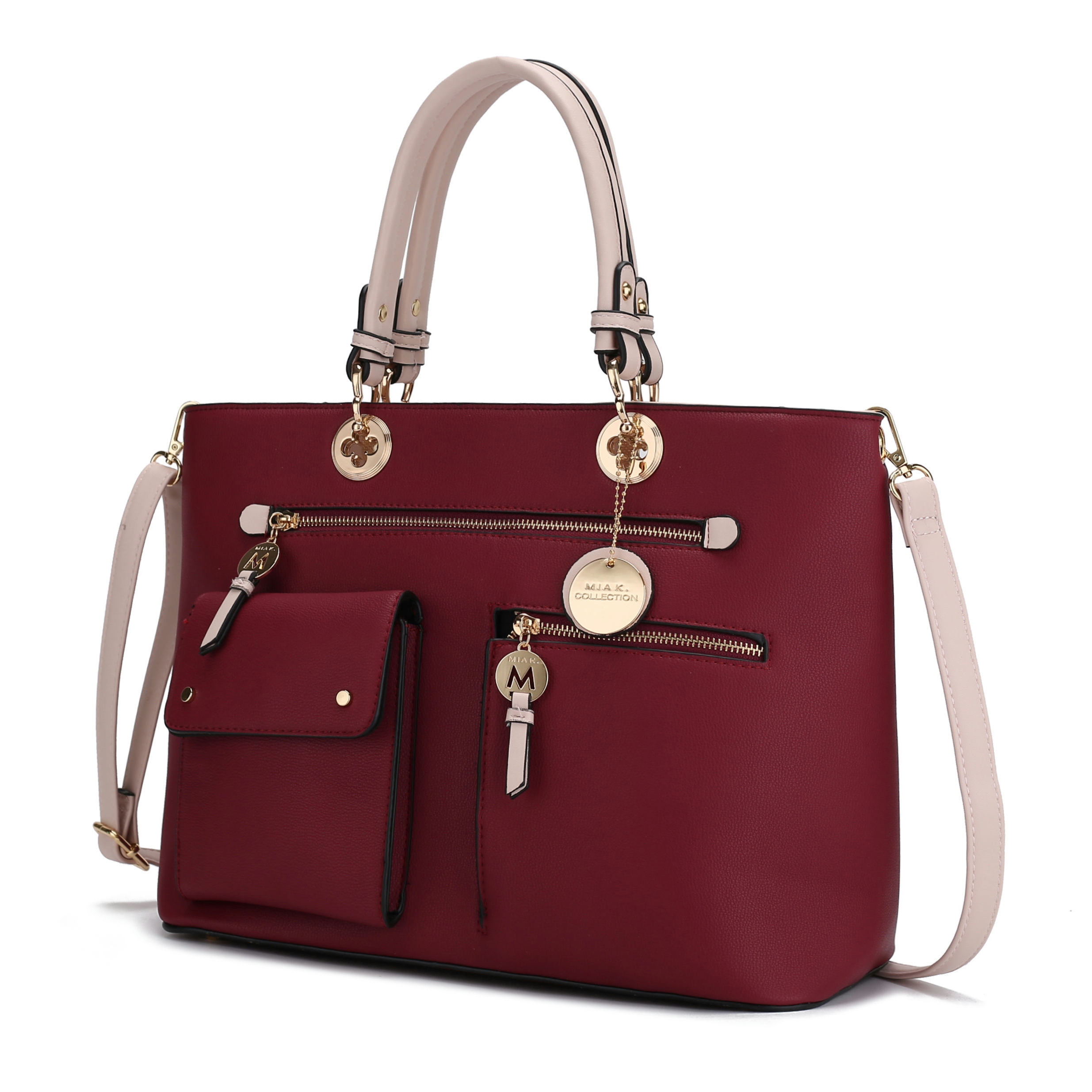A burgundy handbag with beige handles and strap, featuring multiple exterior pockets, gold accents, and decorative charms.