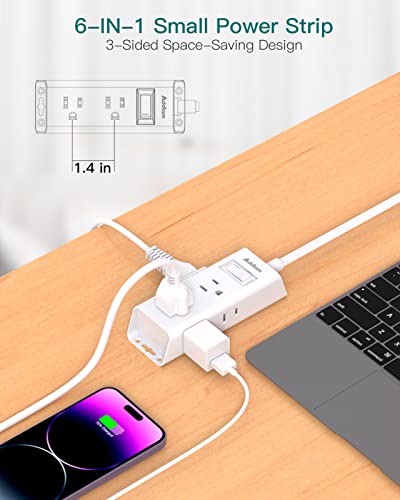A compact 6-in-1 power strip with a flat plug is shown on a desk, charging a phone and powering a laptop with a dimensional depth of 1.4 inches.