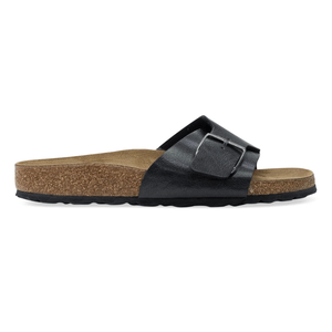 A black sandal with a single wide strap and a large buckle, featuring a cork footbed and rubber sole.