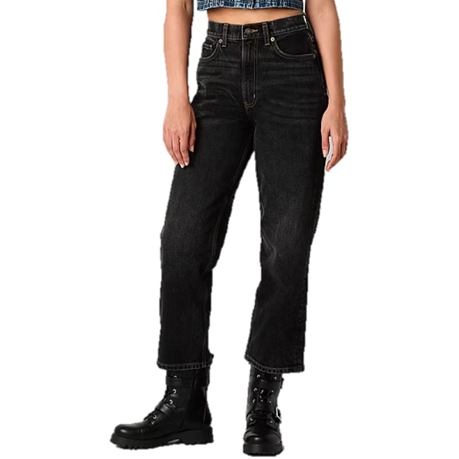 Black high-rise straight-leg jeans paired with black lace-up boots.