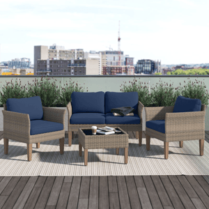 Outdoor patio set with two chairs, a loveseat, and a coffee table, featuring wicker frames and blue cushions on a rooftop deck.