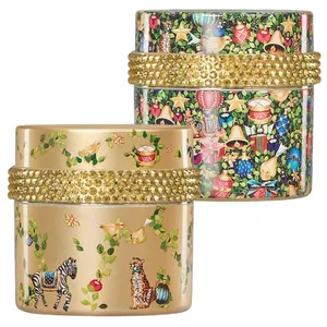 Two ornately designed containers feature colorful, intricate patterns with gold bands studded with embellishments. One container displays a festive theme, while the other highlights animals among leaves and flowers.
