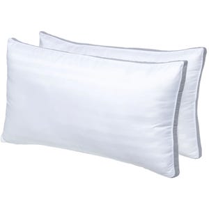 Two white pillows with subtle striped patterns and gray edging, shown side by side.