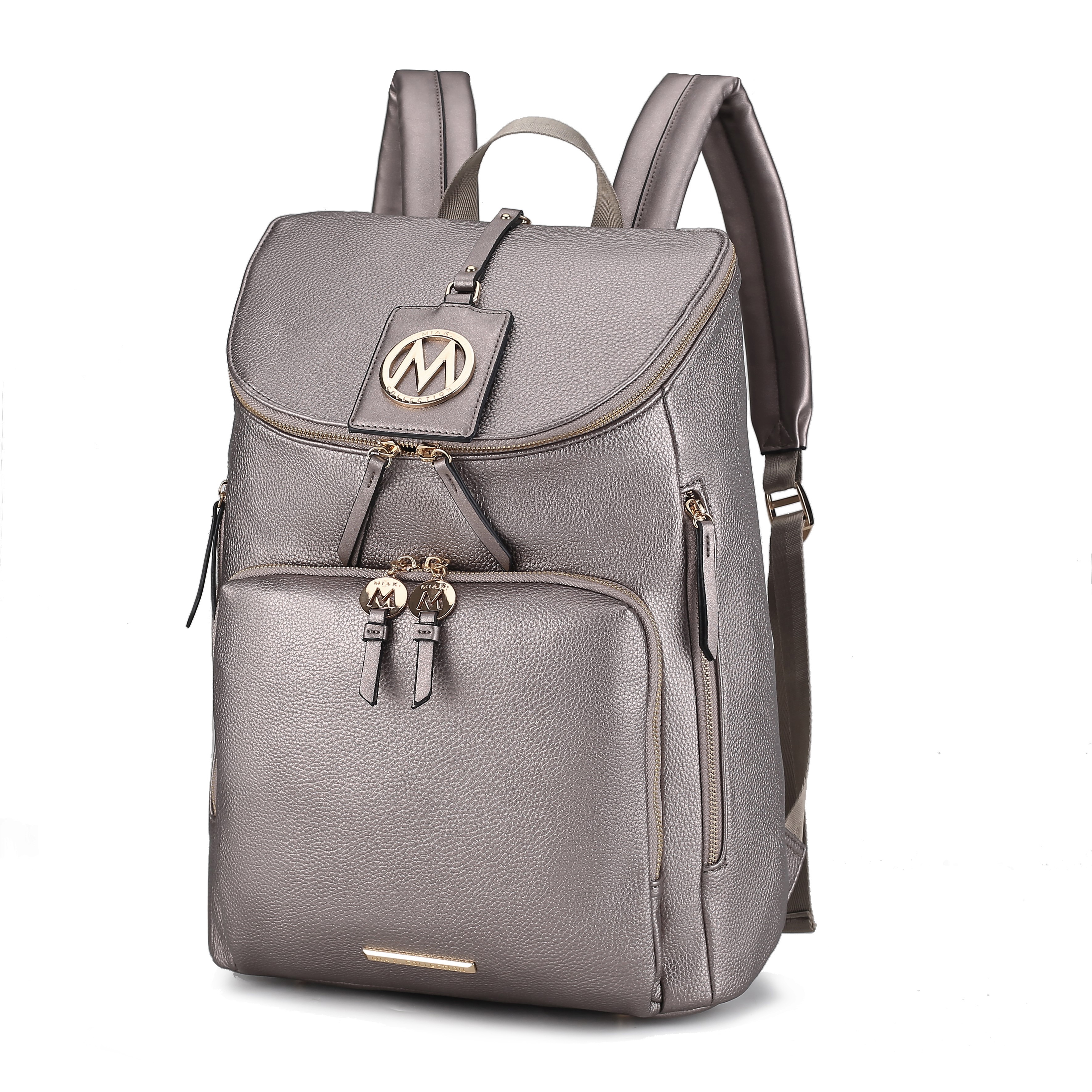 A grey leather backpack with gold-tone hardware, front zip pocket, side zip pockets, and padded straps. Features a prominent \“M\“ logo on the flap.