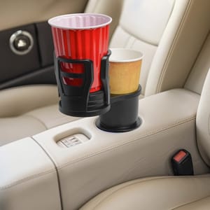 2pk Adjustable Car Cupholder features dual holders stacked vertically to fit different cup sizes, mounted on a standard car console. The design allows for secure placement of two cups or bottles simultaneously.