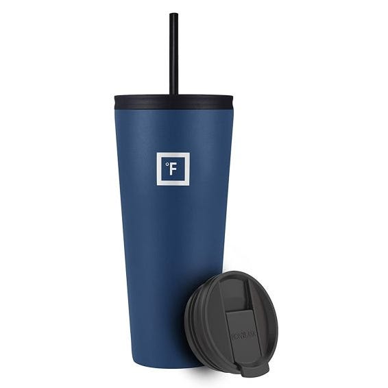 A navy blue 32oz tumbler with a black lid and straw, featuring a square logo with \“°F\“ on the side. An additional black, slide-top lid is shown in front.