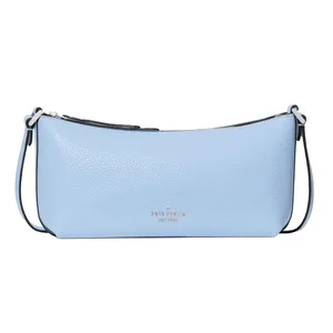 A light blue Kate Spade New York shoulder bag with a pebbled texture and a slim, rectangular shape.