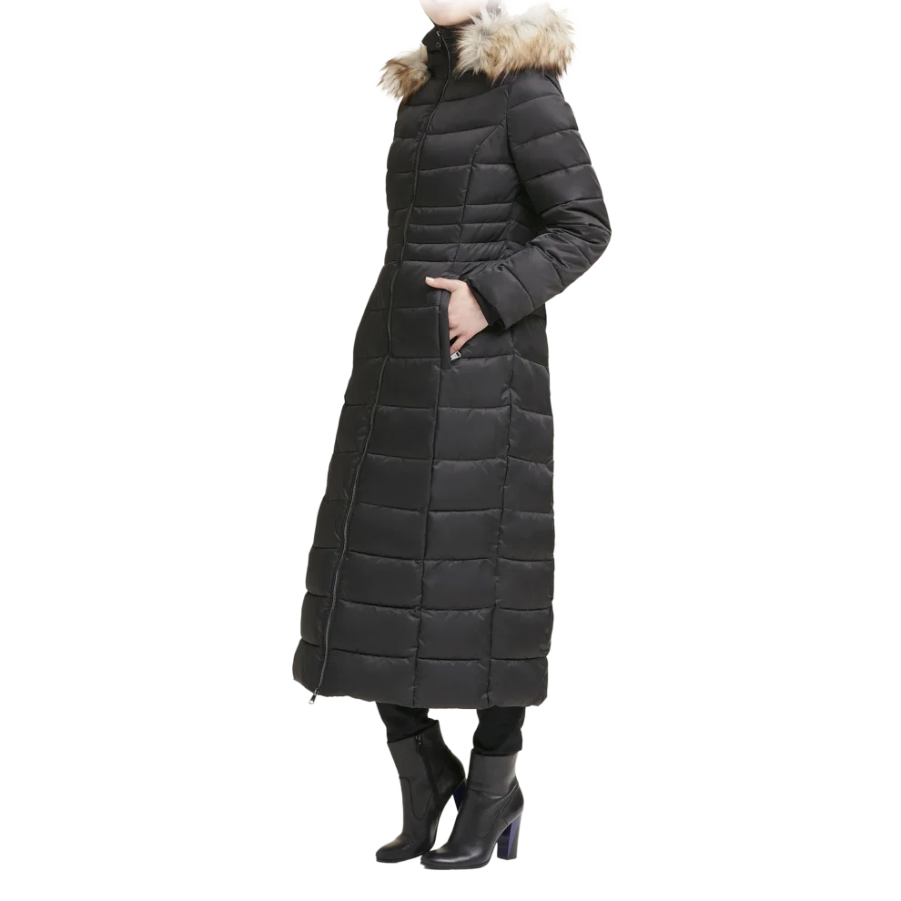 Women's Kenneth Cole Long Parka features a quilted design, full-length style, and a fur-trimmed hood. It has a zip-front closure and side pockets, paired with black boots for a sleek winter look.