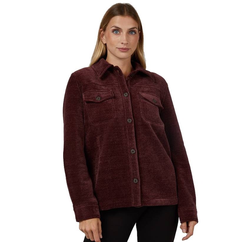 A woman is wearing a burgundy button-up jacket with two chest pockets and a collar. She also wears black pants.