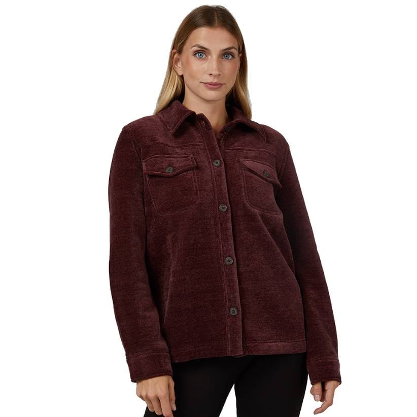A woman is wearing a burgundy button-up jacket with two chest pockets and a collar. She also wears black pants.