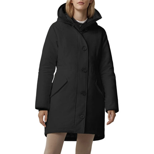 A black hooded winter coat with long sleeves and button closure, worn by a model.