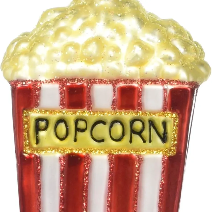 A popcorn-themed Christmas ornament featuring a red and white striped popcorn box with glittery accents.