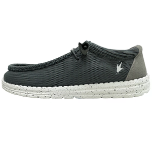 A casual, slip-on shoe with a dark mesh upper, a cushioned speckled white sole, and a small bird emblem on the side, designed for comfort and ease.