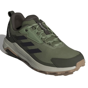 A green Adidas Terrex trail running shoe with black stripes, featuring a rugged design and durable grip for outdoor activities.