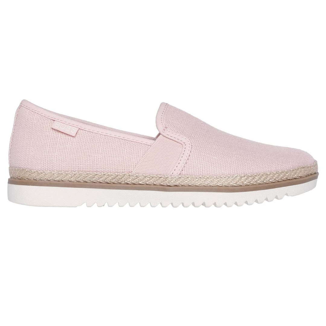 Light pink slip-on shoes with a canvas upper, featuring braided detailing along the midsole and a textured white rubber outsole for grip.