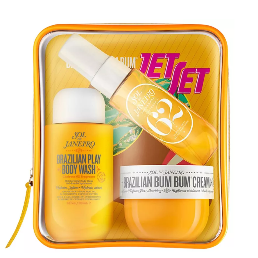 Set from Sol de Janeiro featuring Brazilian Play Body Wash, Brazilian Crush 62 Body Fragrance Mist, and Brazilian Bum Bum Cream in a transparent zippered pouch.