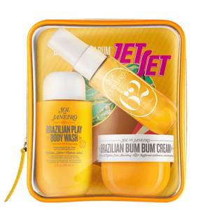 Set from Sol de Janeiro featuring Brazilian Play Body Wash, Brazilian Crush 62 Body Fragrance Mist, and Brazilian Bum Bum Cream in a transparent zippered pouch.