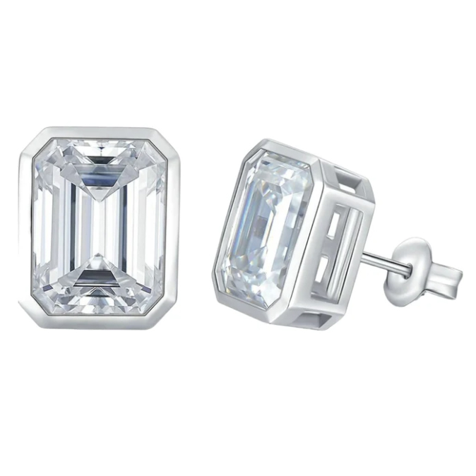Emerald-cut earrings feature a rectangular gemstone with clipped corners, set in a silver-tone bezel. They have a classic stud design with a post and butterfly backing.