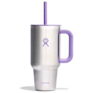 A stainless steel 32oz Hydro Flask Travel Tumbler with a purple handle, lid, and straw, featuring a purple Hydro Flask logo.