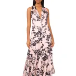 A sleeveless halter-neck maxi dress with a plunging neckline, featuring a pink base with black floral prints.