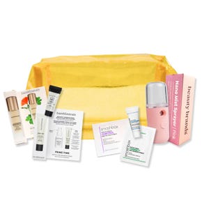 The Beauty Brands Makeup Ready Bundle includes BareMinerals serums and primers, Smashbox primers, Nano Mist Sprayer, and skincare samples in a yellow zippered pouch.