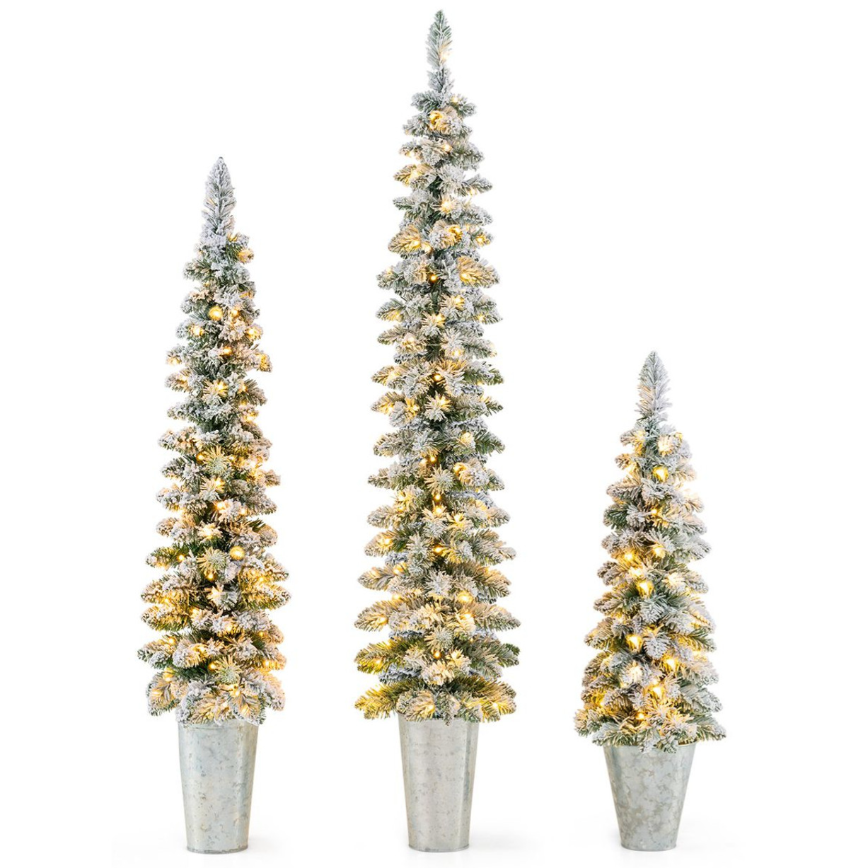 Three tall, slender artificial Christmas trees with frosted tips and warm lights, placed in rustic metal pots.