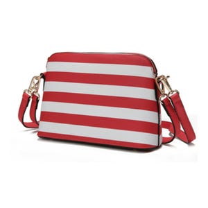 A red and white striped crossbody bag with a smooth finish, featuring gold-tone hardware and an adjustable strap for easy carrying.