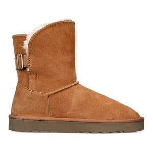 Style & Co. Teeny Winter Booties are mid-height boots in brown suede with a shearling lining, featuring a side buckle detail and flat rubber soles for comfort and warmth.