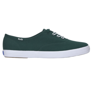 A dark green canvas sneaker with white laces and a white rubber sole, featuring the Keds logo on the side.