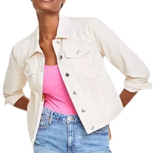 Ecru classic denim trucker jacket with long sleeves, button closure, chest pockets, and a relaxed fit. Worn over a pink top and paired with blue jeans.