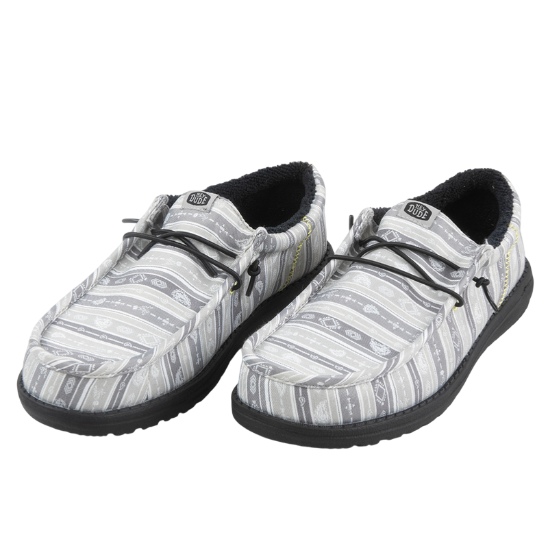 Gray slip-on shoes with black soles and patterned fabric design, featuring elastic laces and fur-lined interiors.