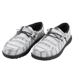 Gray slip-on shoes with black soles and patterned fabric design, featuring elastic laces and fur-lined interiors.