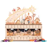 A wooden advent calendar features a festive village scene with Santa in a sleigh, reindeer, and snowy houses. It has numbered compartments for daily surprises during the holiday season, with toys scattered around it.