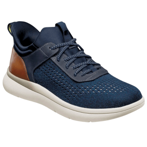A navy blue athletic shoe with a knit upper, gray laces, a white sole, and brown leather accents on the heel.